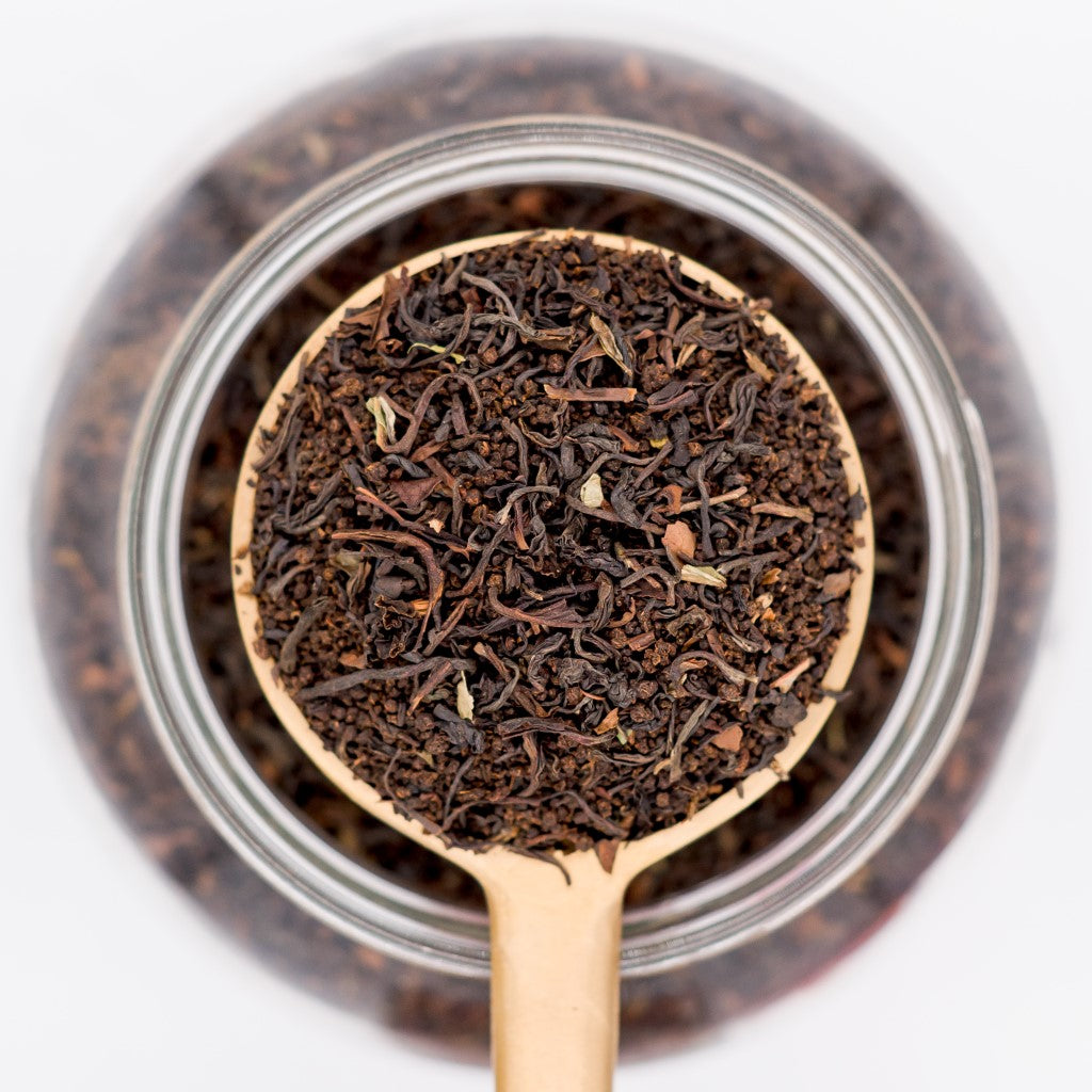 Scoop of True Blend loose leaf tea blend. Made with a mixture of Darjeeling, Assam, and Orange Pekoe teas.