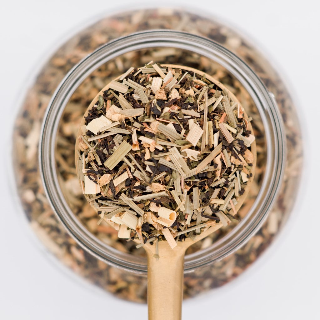 Scoop of Parsi Dream loose leaf tea blend. Made with black tea, lemongrass, ginger and  mint.