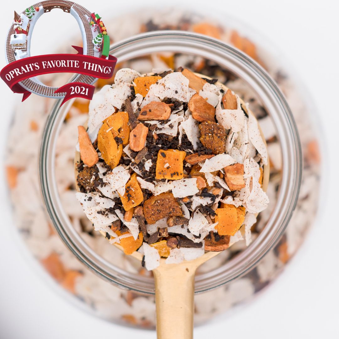 Scoop of Sweet Monsoon loose leaf tea blend. Made with black tea, mangoes, coconut, cinnamon and clove. Oprah's Favorite Things 2021.