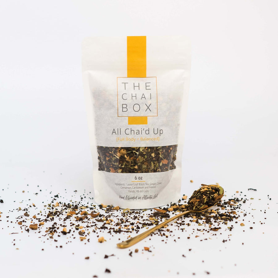 The Chai Box All Chai'd Up Loose Leaf Tea Blend bag with spoon. All Chai'd Up is an infusion of Western and Eastern flavors. 