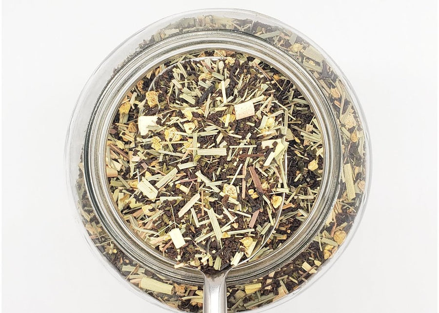 Scoop of Parsi Dream loose leaf tea blend. Made with black tea, lemongrass, ginger and mint.