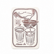 chai pouring into two cups with The Chai Box Cafe logo