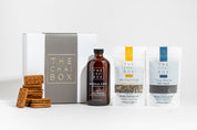 The Chai Box Gift Set including a magnetic box, Chai Concentrate, and loose-leaf tea with a pack of chocolate biscuits