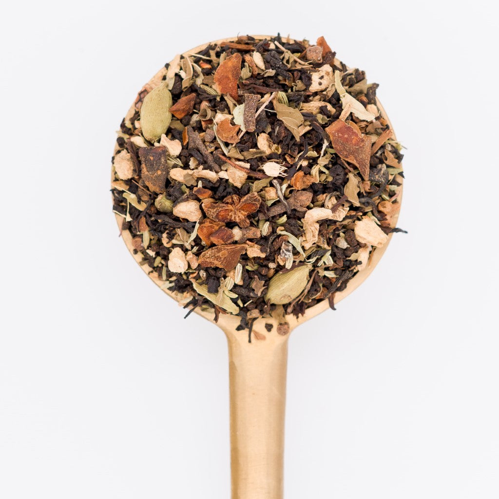 Chai Tonic Loose Leaf Tea Blend Scoop. Made with black tea, tulsi, elderberries, cardamom, ginger, star anise, brahmi and ajwain. 