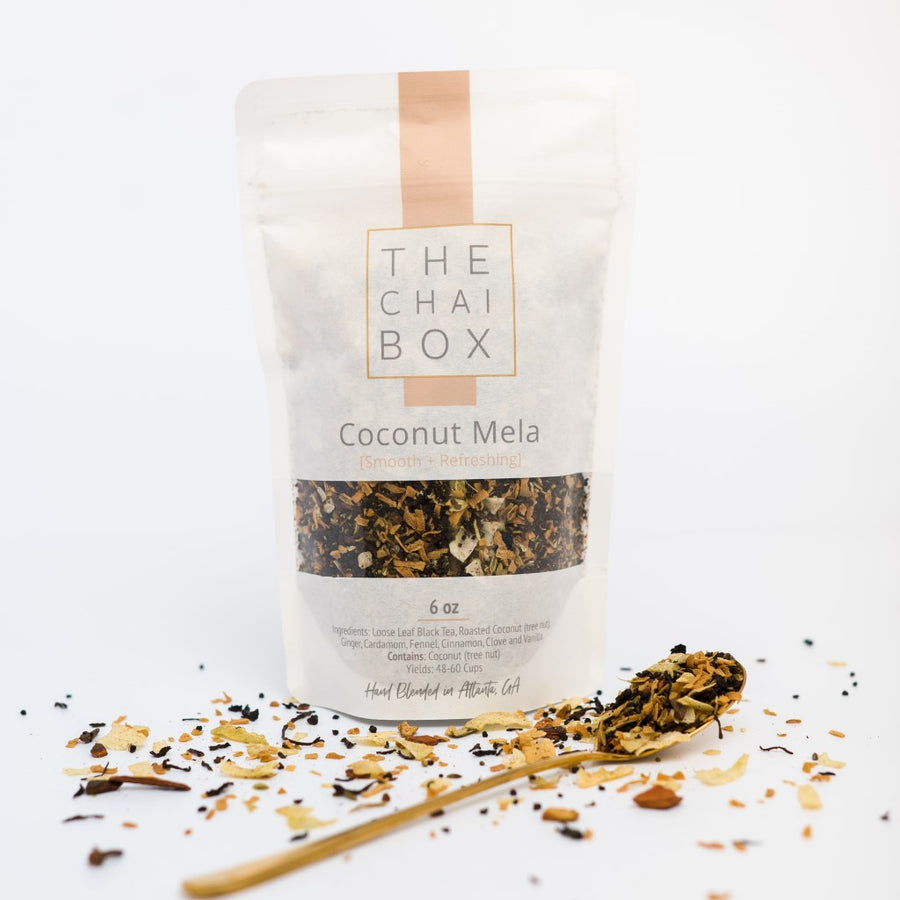 The Chai Box Coconut Mela Loose Leaf Tea Blend bag with spoon. Coconut Mela is inspired by festivals. A chai to enjoy with family. 