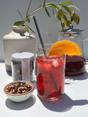 Tea poured over ice. Jaipur Summer a Hibiscus and orange is perfect as an iced chai.  