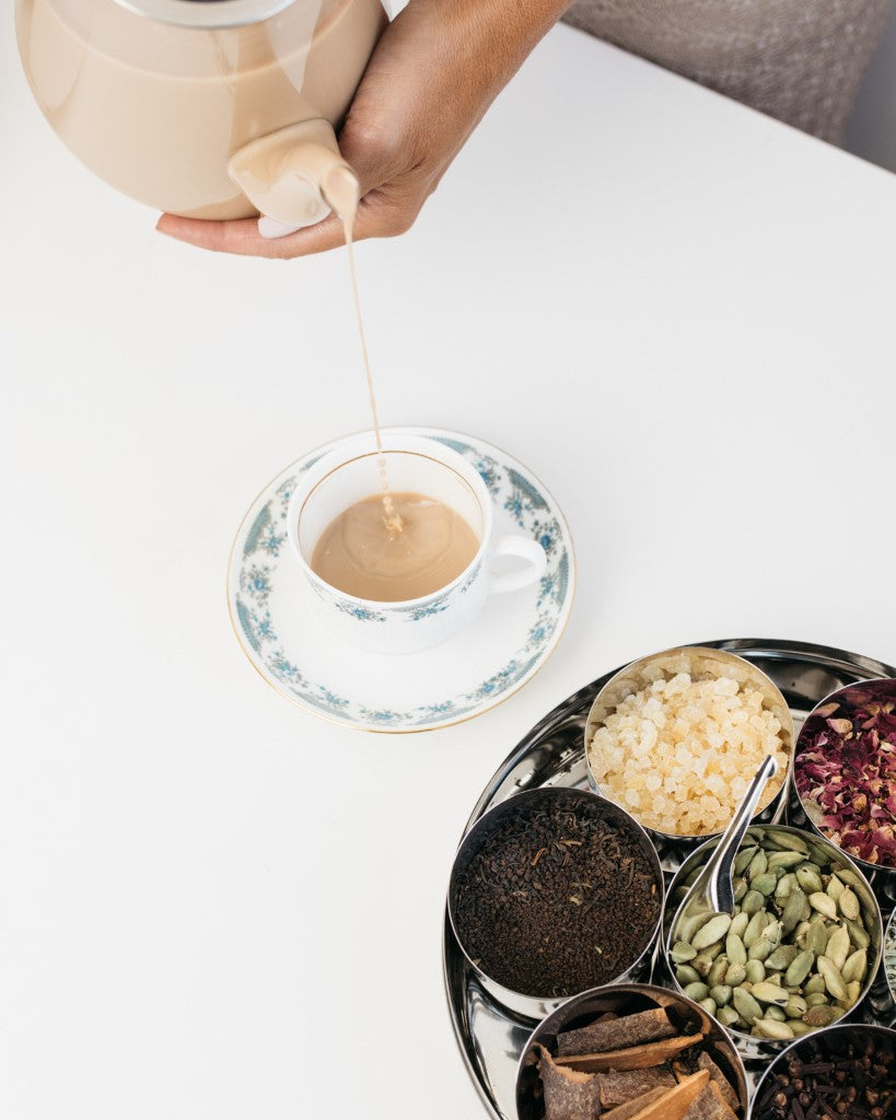 Chai being poured to a cup made with The Chai Box Gift Set. 