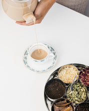 Chai being poured to a cup made with The Chai Box Gift Set. 