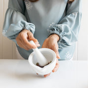 The Chai Box Mortar and pestle is made of ceramic. Great for grinding herbs and spices for an authentic chai. 